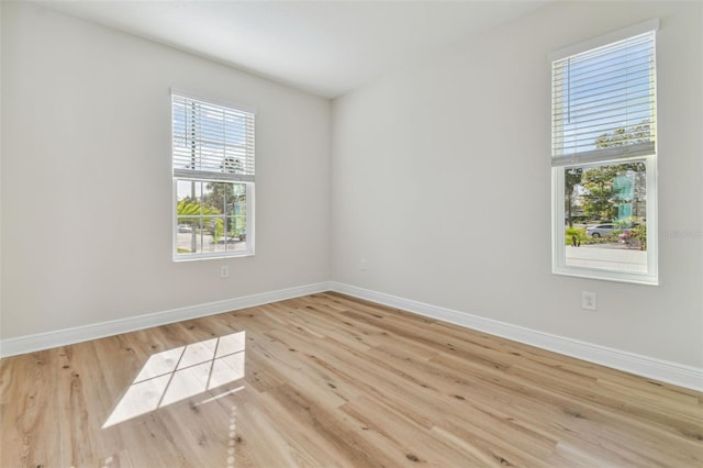 unfurnished room featuring light hardwood / wood-style floors