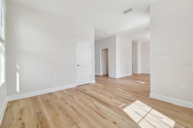 unfurnished room with light hardwood / wood-style flooring