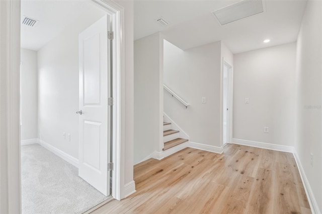 staircase featuring hardwood / wood-style floors