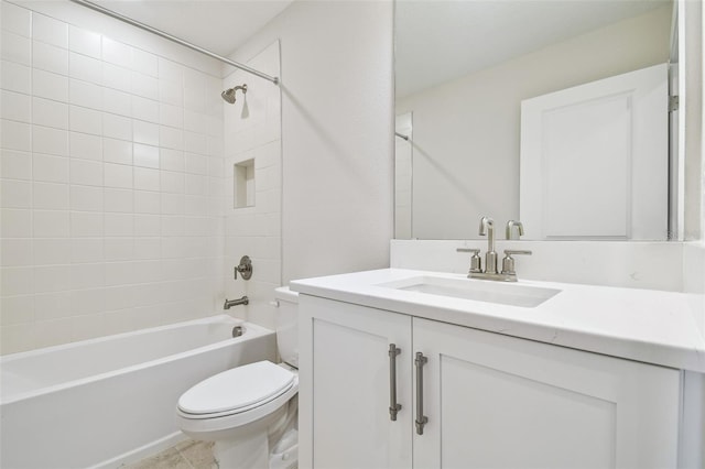 full bathroom with vanity, toilet, and tiled shower / bath