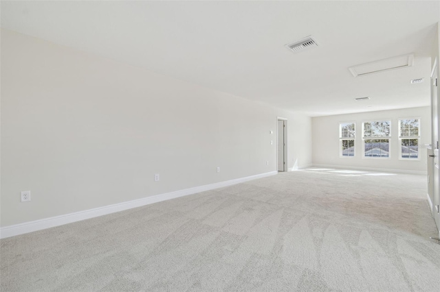 spare room with light colored carpet