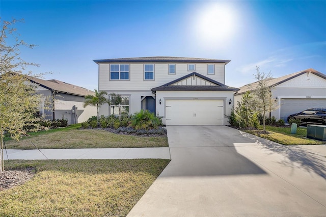 view of front facade featuring a front lawn and a garage