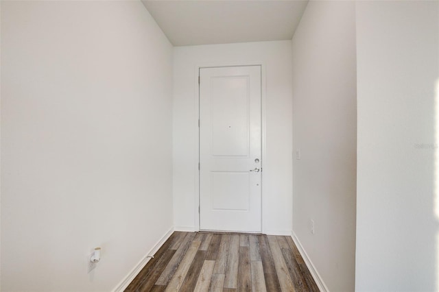 empty room featuring dark wood-type flooring