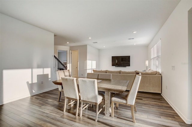 dining area featuring dark hardwood / wood-style floors