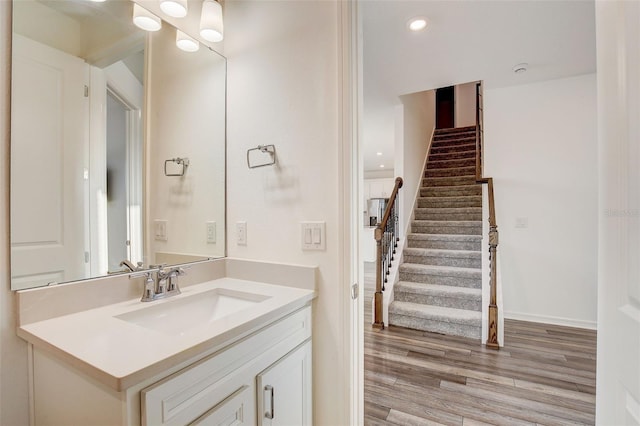 bathroom featuring vanity and wood-type flooring