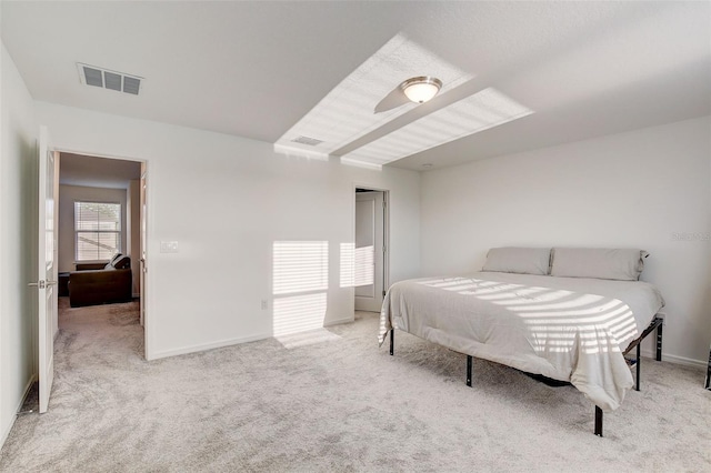 bedroom featuring light carpet