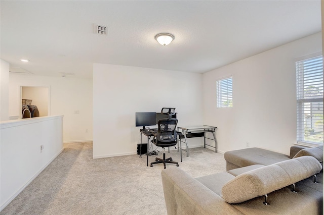 office area with light colored carpet