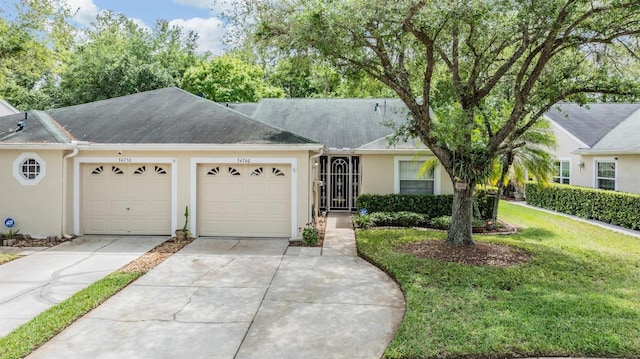 ranch-style home with a front yard and a garage