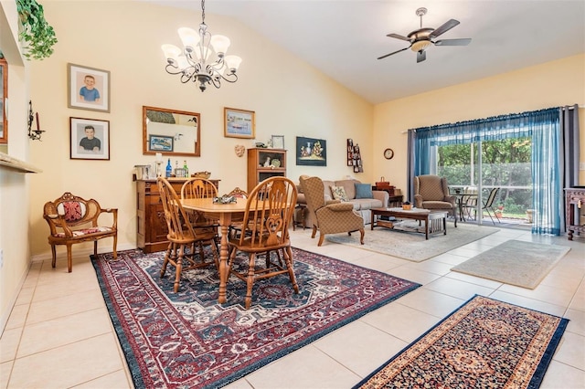 dining room featuring light tile floors, high vaulted ceiling, and ceiling fan with notable chandelier