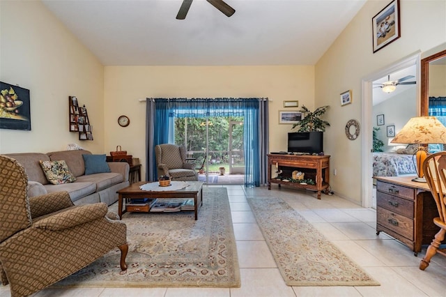 tiled living room with ceiling fan