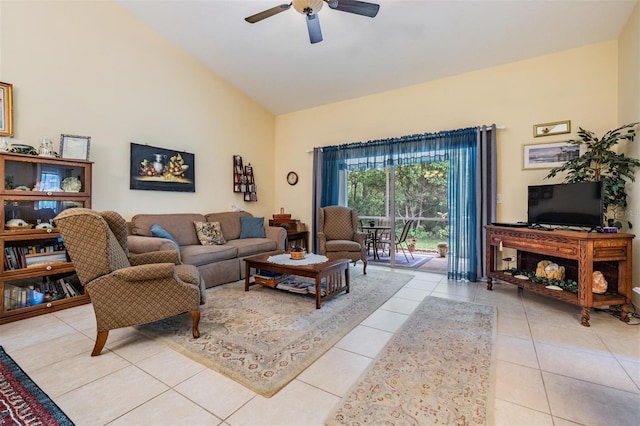 tiled living room with lofted ceiling and ceiling fan