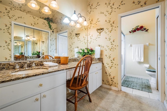 bathroom with toilet, tile flooring, and oversized vanity