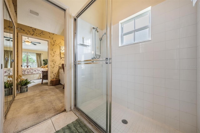 bathroom with an enclosed shower, tile flooring, and ceiling fan