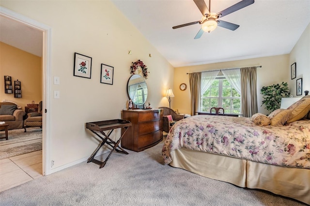 carpeted bedroom with vaulted ceiling and ceiling fan