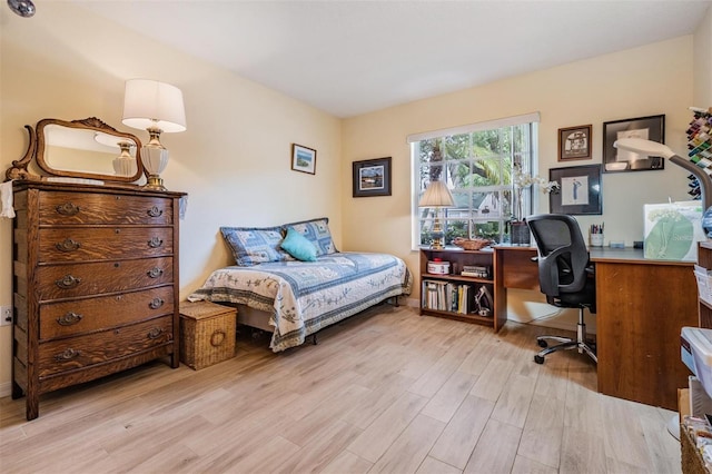 office with light hardwood / wood-style flooring