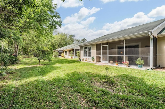 view of yard with a sunroom