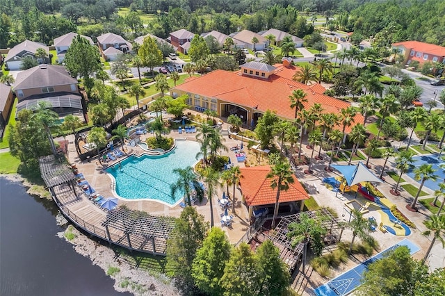 birds eye view of property with a water view