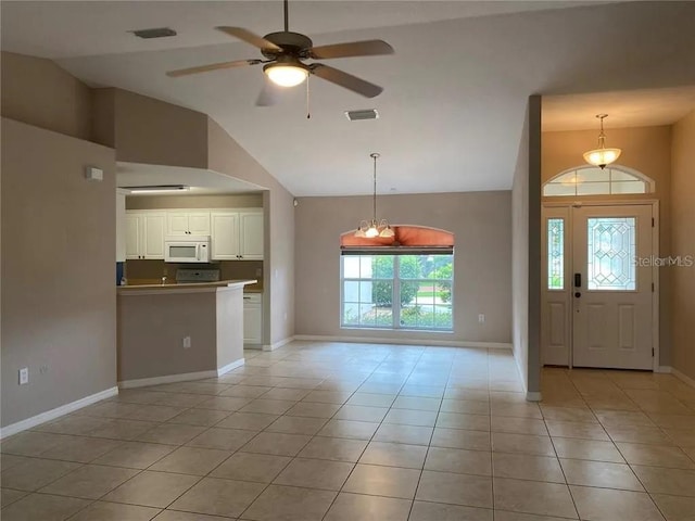 tiled foyer with high vaulted ceiling and ceiling fan