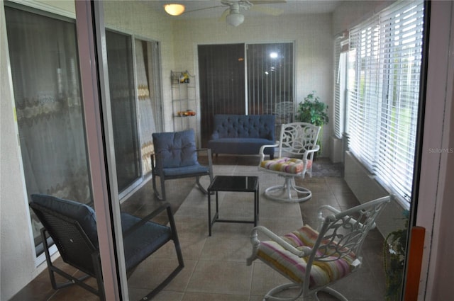 sunroom with plenty of natural light and ceiling fan