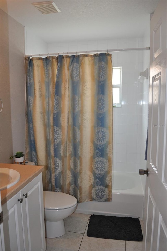 full bathroom with shower / bath combo, toilet, vanity, and tile flooring