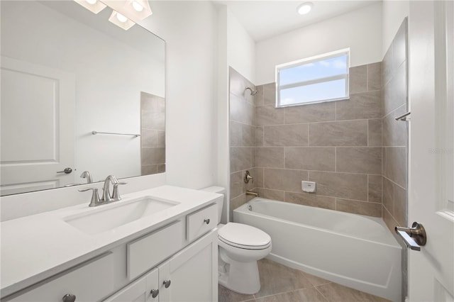 full bathroom with tiled shower / bath combo, toilet, vanity, and tile flooring