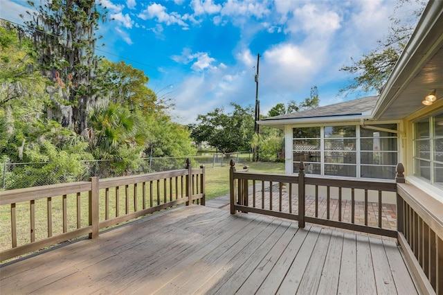 wooden terrace with a lawn