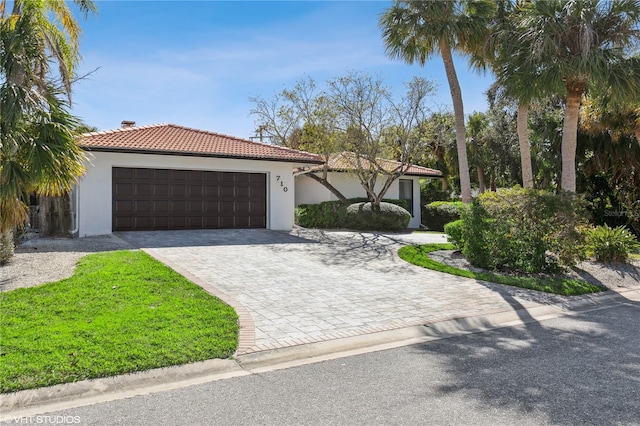 mediterranean / spanish house featuring a garage