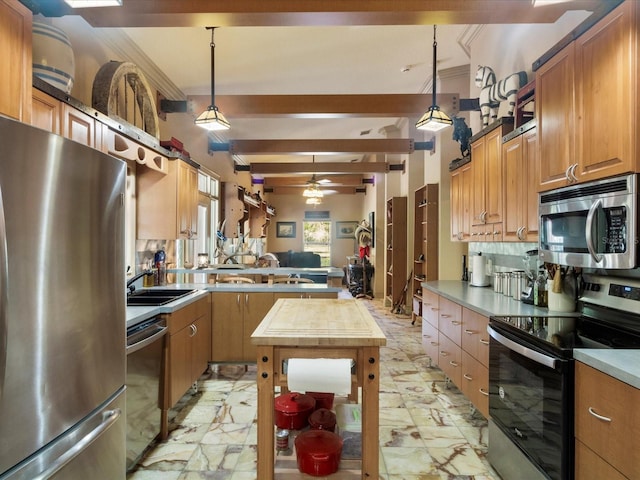 kitchen featuring marble finish floor, stainless steel appliances, and decorative light fixtures