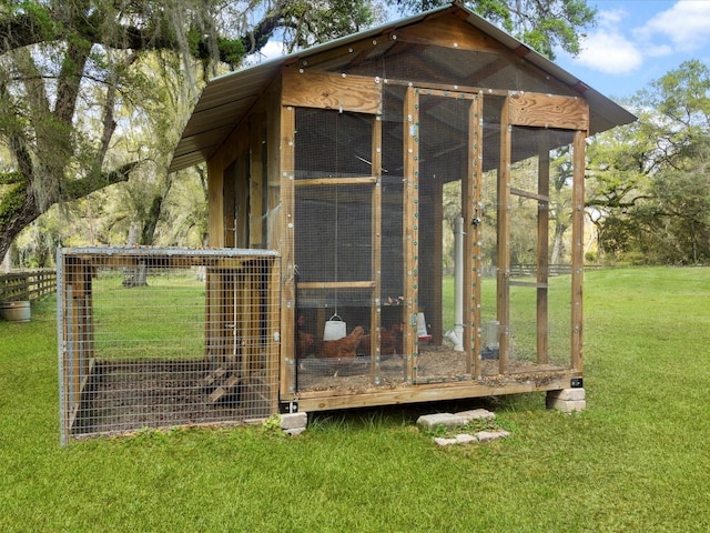 view of poultry coop with a yard