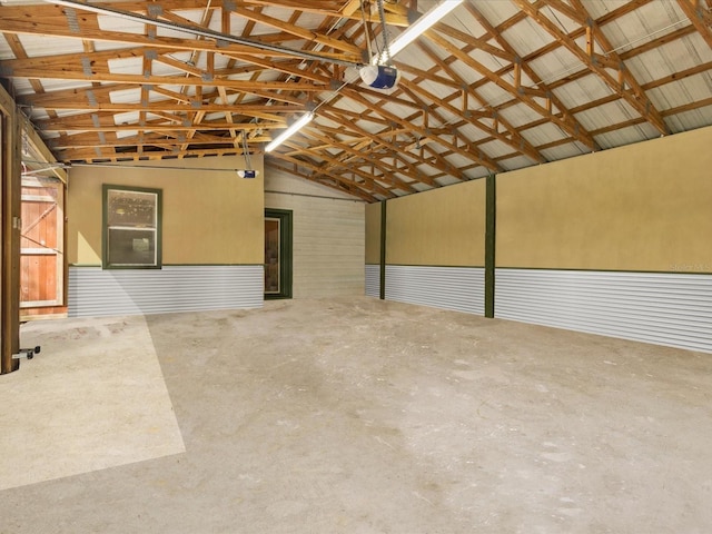 garage with metal wall and a garage door opener