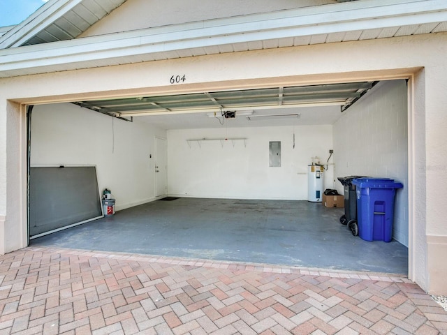 garage featuring water heater and a garage door opener