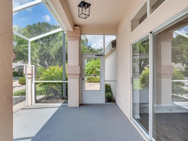 unfurnished sunroom featuring a wealth of natural light