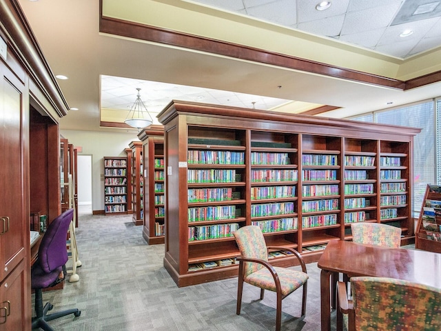 office area with light carpet and a paneled ceiling