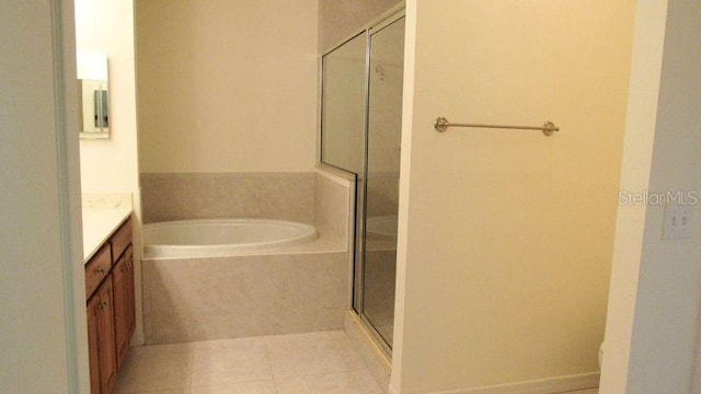 bathroom with vanity, tile flooring, and independent shower and bath