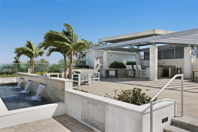 exterior space featuring a deck and a pergola