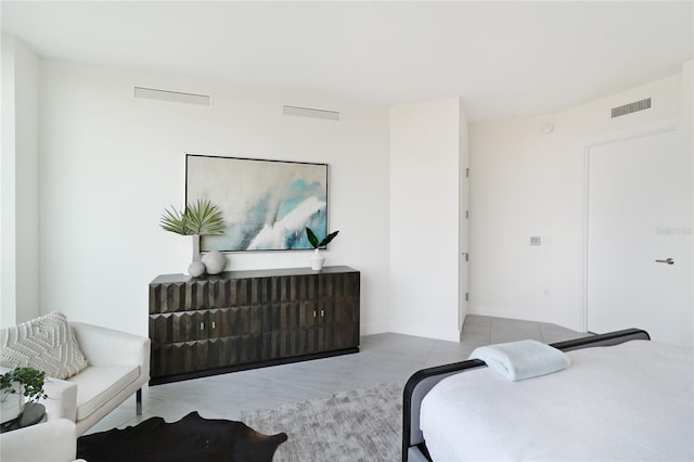 bedroom featuring light tile patterned flooring