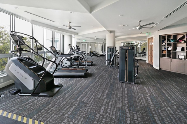 gym with ceiling fan and dark carpet