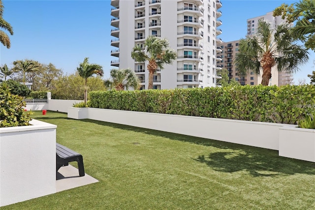 view of yard featuring a balcony