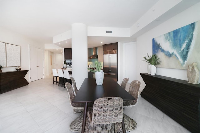 dining space with light tile patterned floors