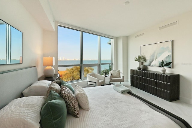 bedroom featuring a water view