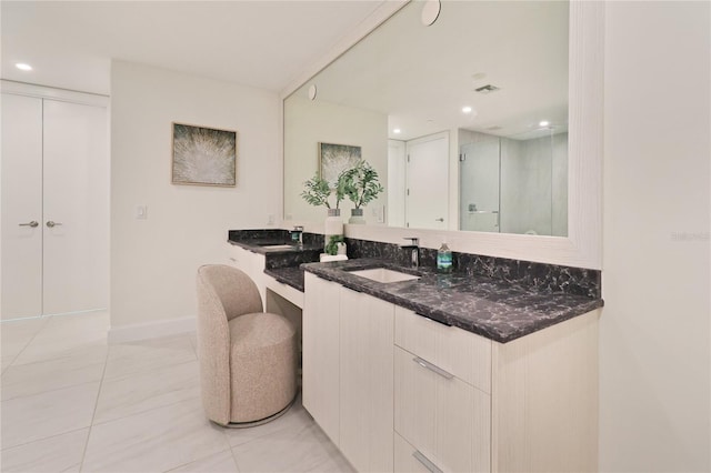 bathroom featuring tile patterned floors and vanity