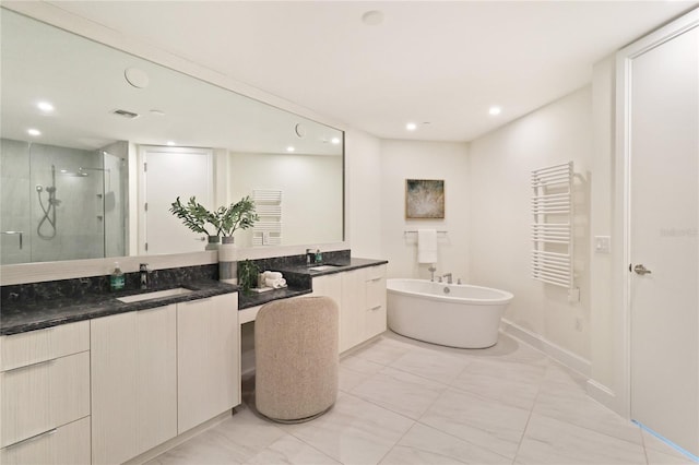 bathroom with radiator heating unit, double vanity, independent shower and bath, and tile patterned floors