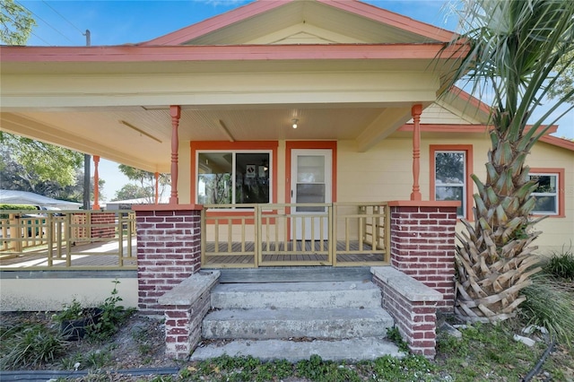 entrance to property with a porch