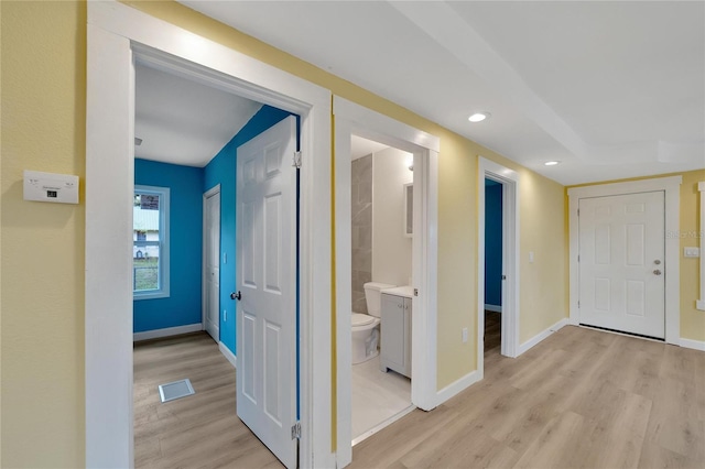 corridor featuring light hardwood / wood-style flooring