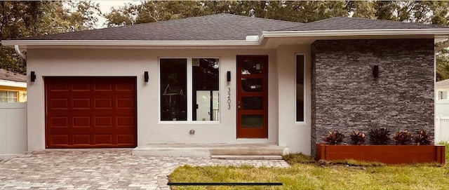 view of front of property with a garage