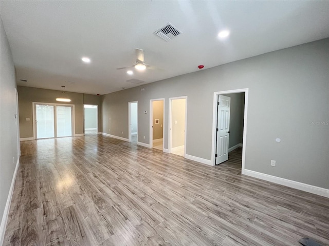 unfurnished room featuring ceiling fan and light wood-type flooring