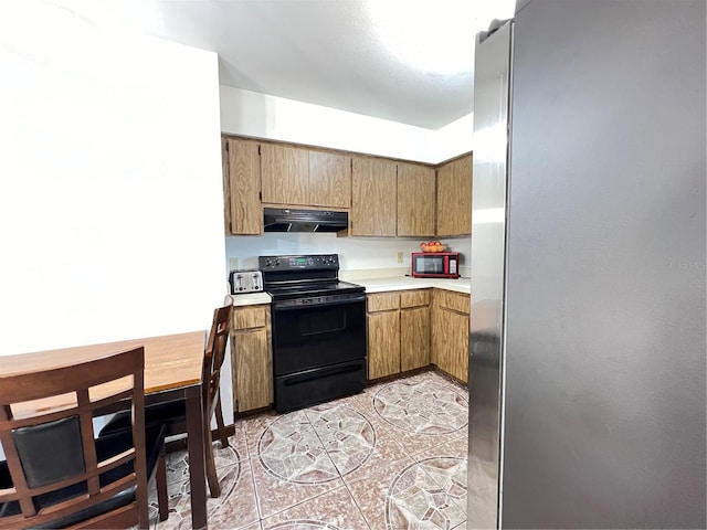 kitchen featuring light tile flooring, ventilation hood, and black appliances