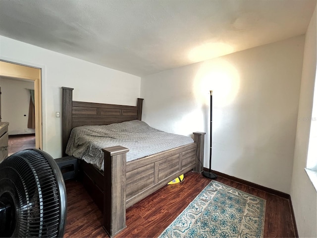 bedroom featuring dark hardwood / wood-style flooring