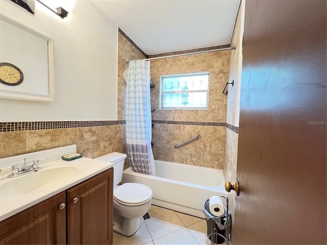 full bathroom with tile walls, toilet, vanity with extensive cabinet space, shower / bath combination with curtain, and tile flooring