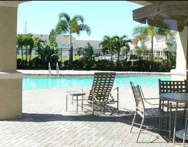 view of pool featuring a patio